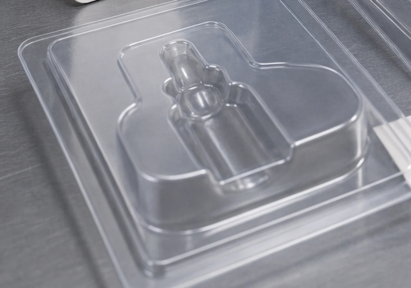 Clear thermoformed plastic packaging tray and blister style insert