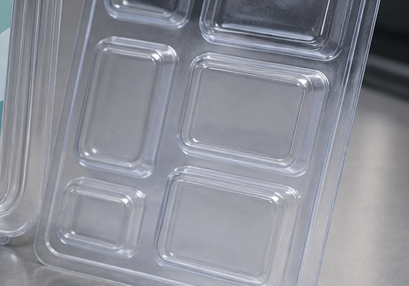 Clear thermoformed plastic packaging tray and blister style insert