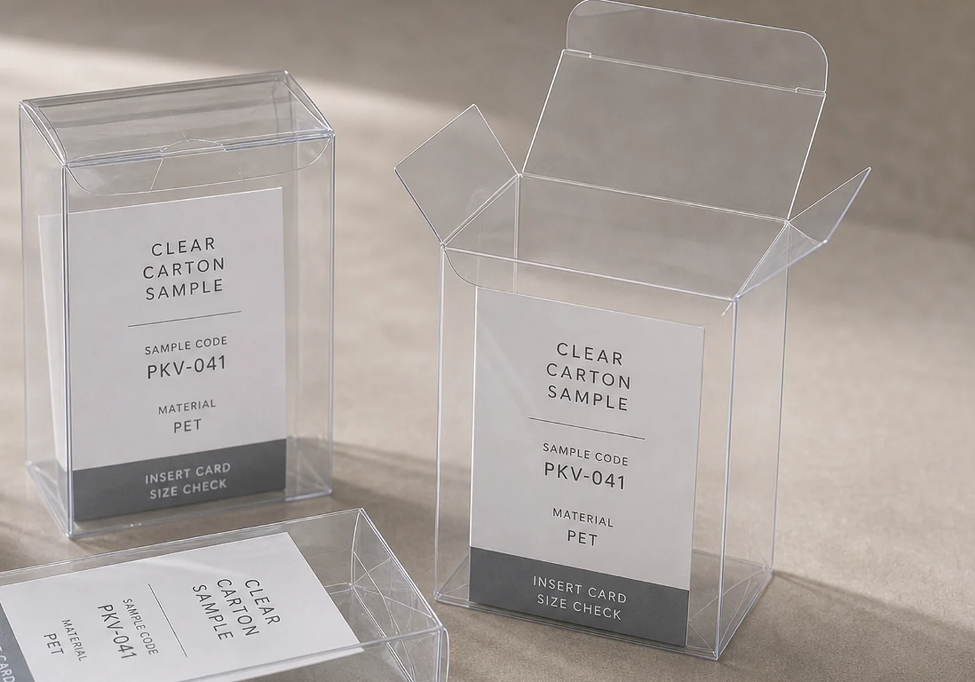 Clear PET carton sample with printed insert, open flap, and transparent box structure