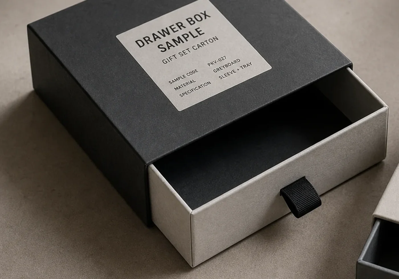 Drawer box close-up showing sliding tray construction and printed sample label