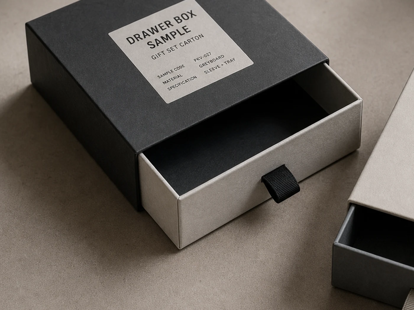 Rigid drawer box sample with sliding tray, ribbon pull tab, and printed specification label