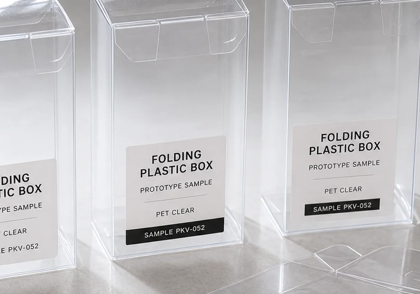 Transparent folding carton sample with flat PET panel and assembled clear box structure