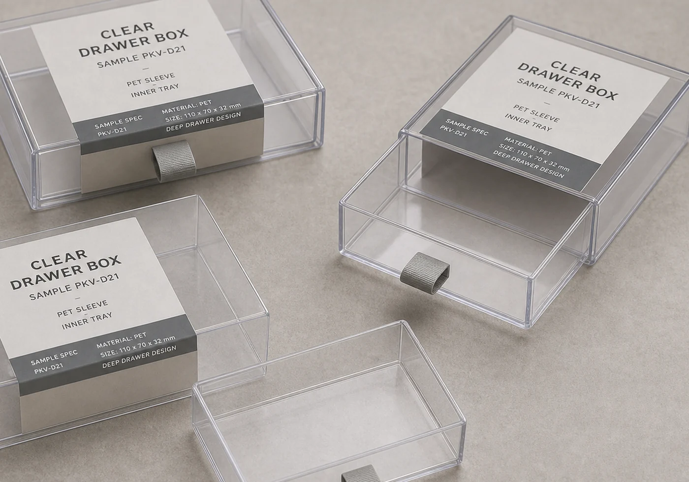 Clear drawer packaging close-up showing sliding tray, transparent PET sleeve, and sample specification label