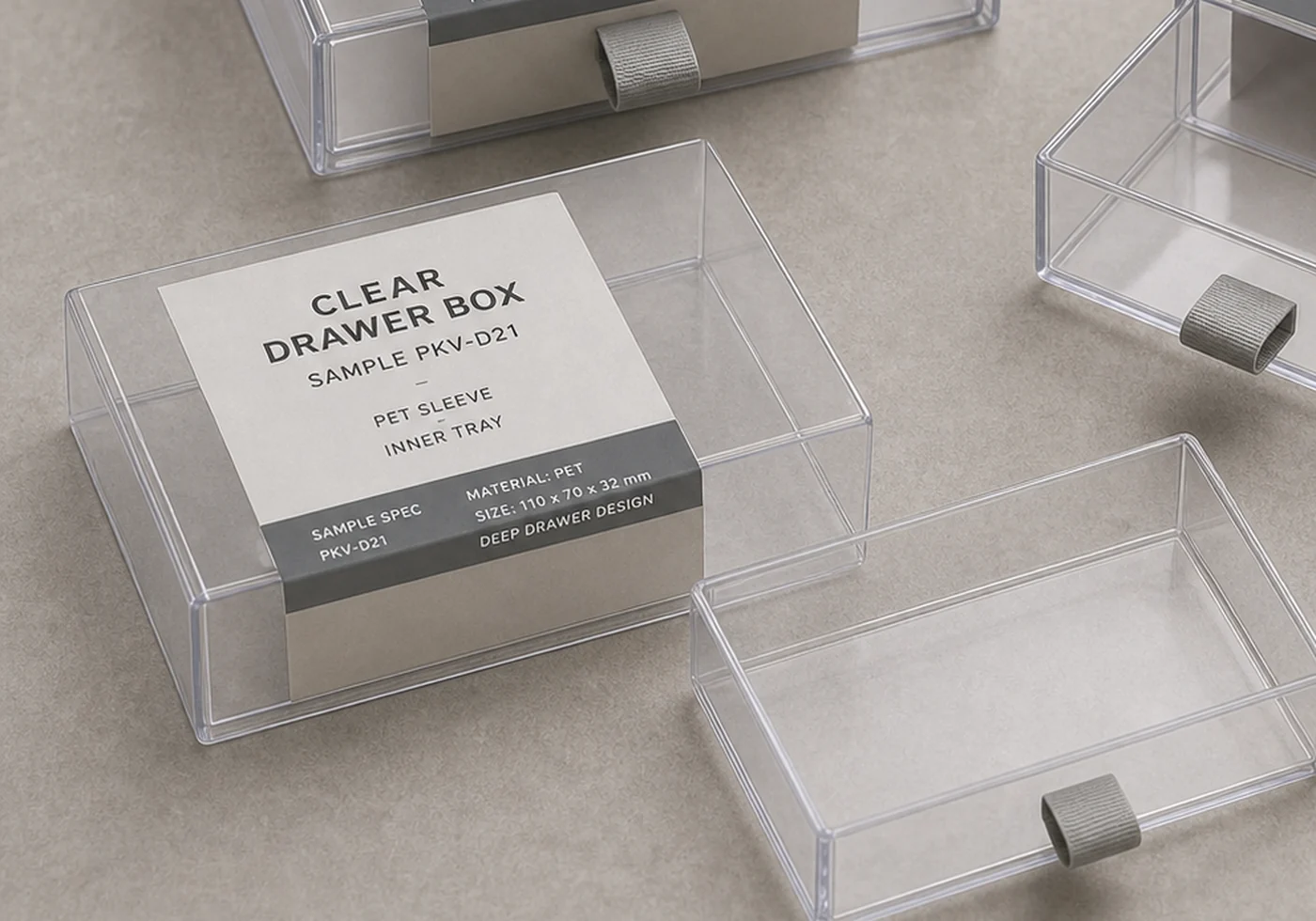 Plastic drawer box tray detail with clear PET walls, pull tab, and printed sample insert