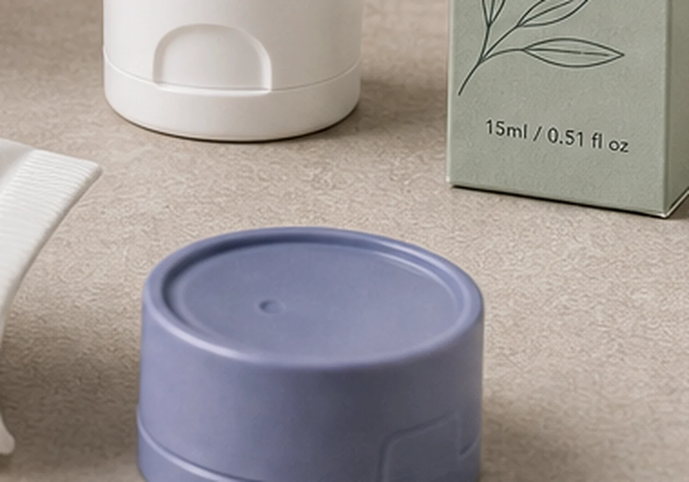 Plastic tube packaging samples with caps, printed label card, and tube base detail