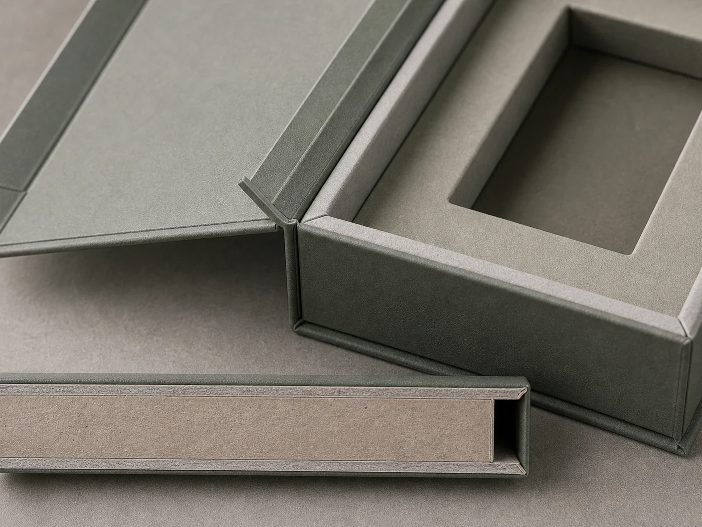 Rigid presentation box close-up with wrapped board, nested tray, and printed specification label