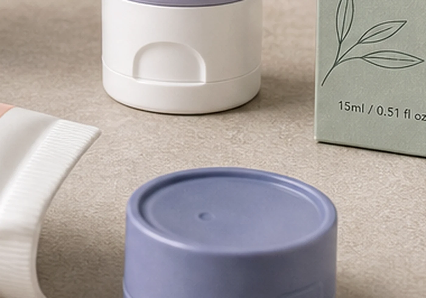 Tube cap and closure samples with plastic cap shapes, tube base, and color reference card