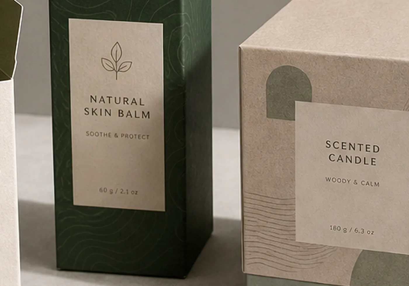 Tuck-end carton close-up with open flap, paperboard texture, and printed candle sample label